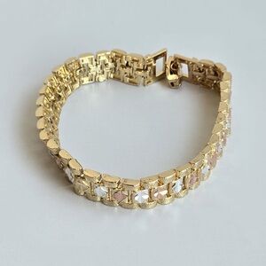 Women’s watch band style link bracelet.